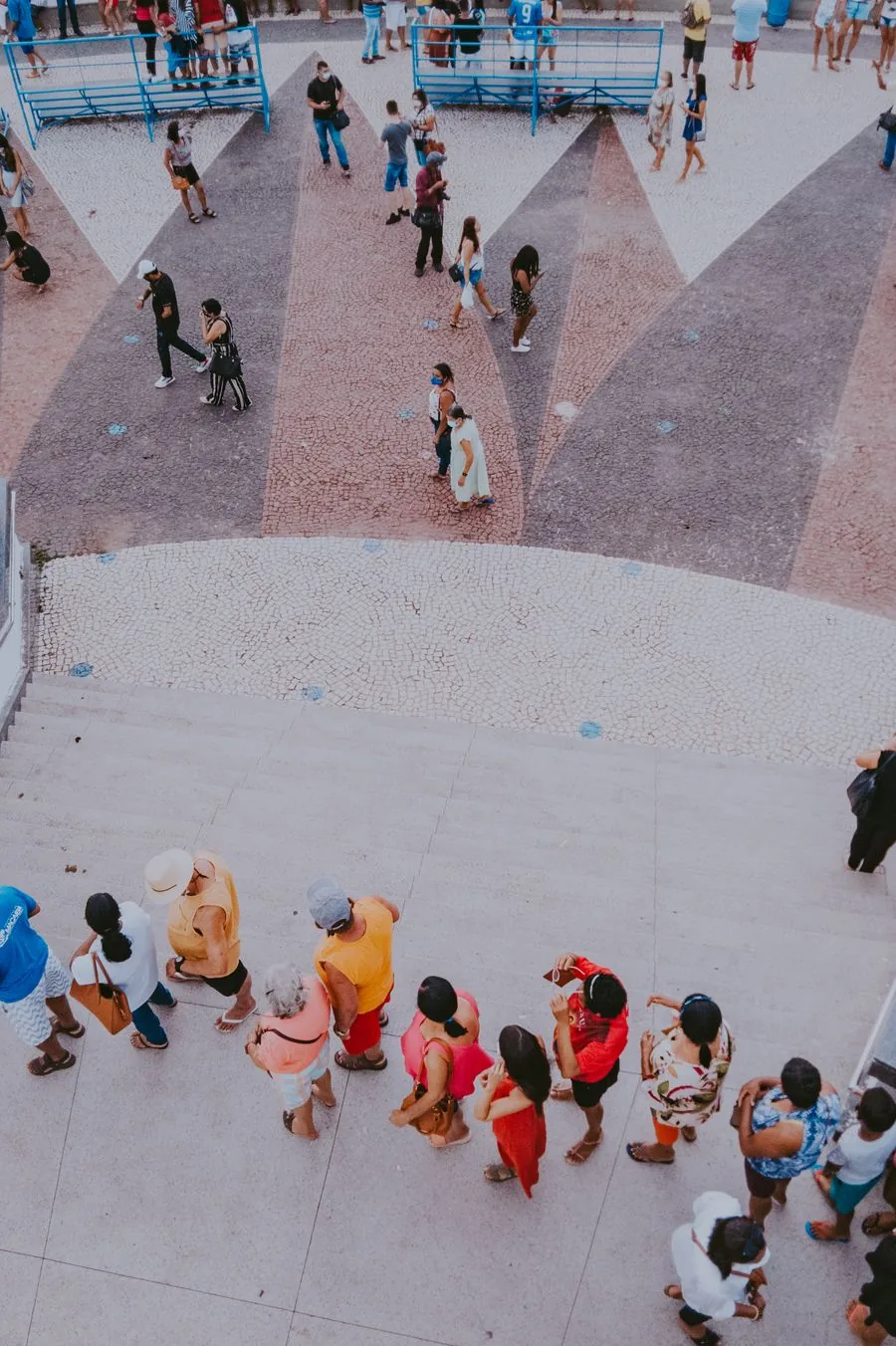 People standing in a queue outdoors