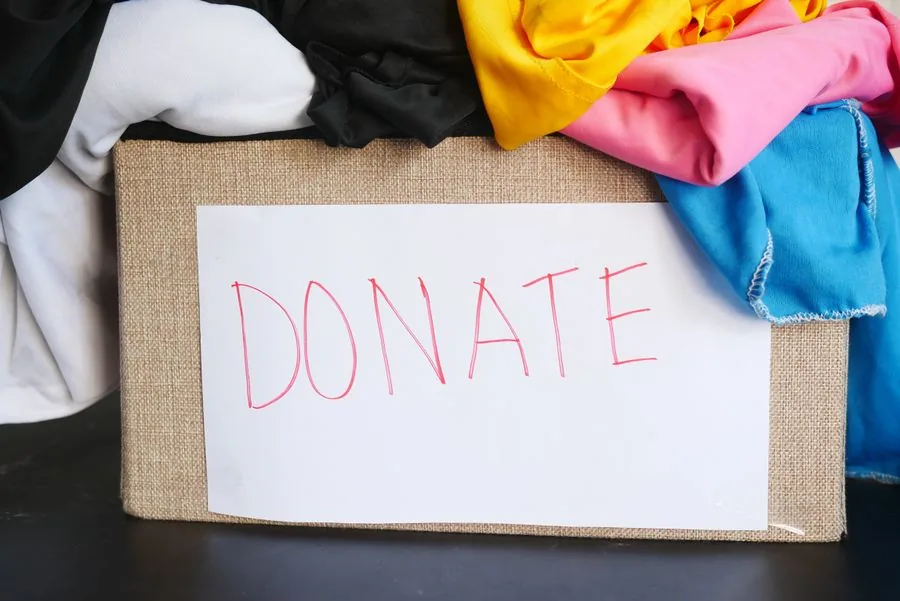 A box of clothes and goods packed up for donation