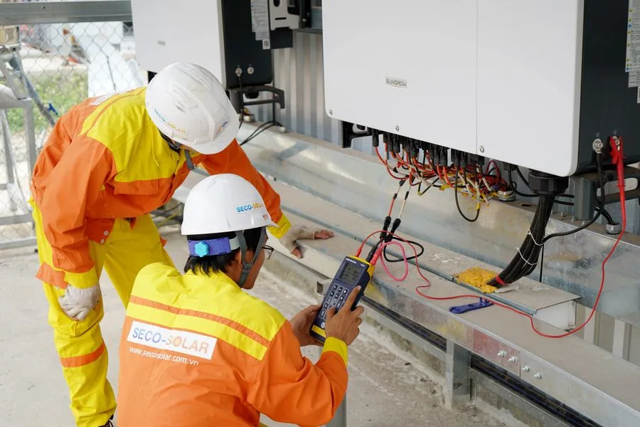 Two workers collaborating on a job site