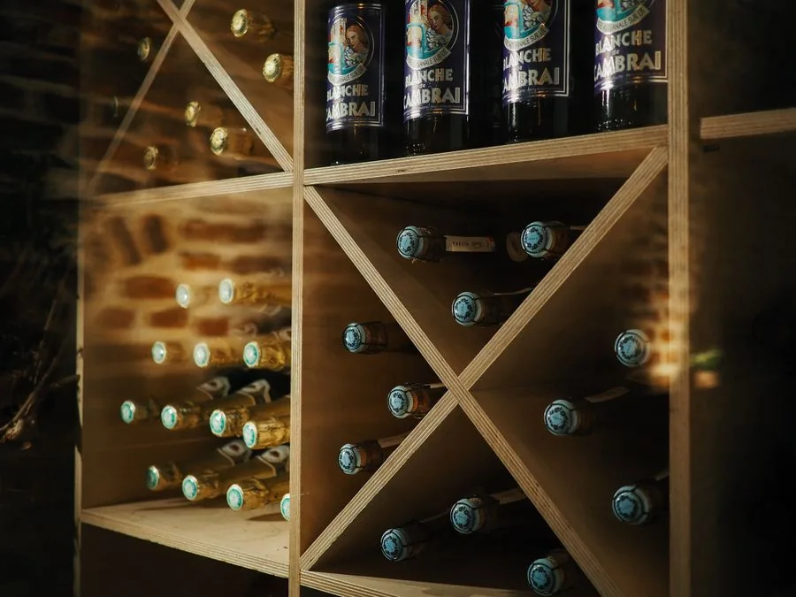 Beer and wine bottles on the shelves of a local bottle shop