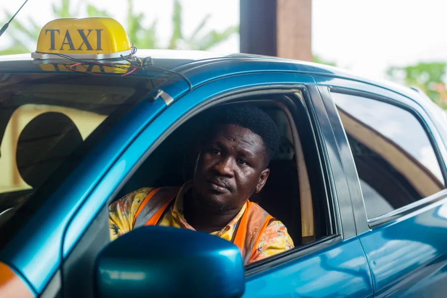 A friendly driver ready to take a passenger to their appointment
