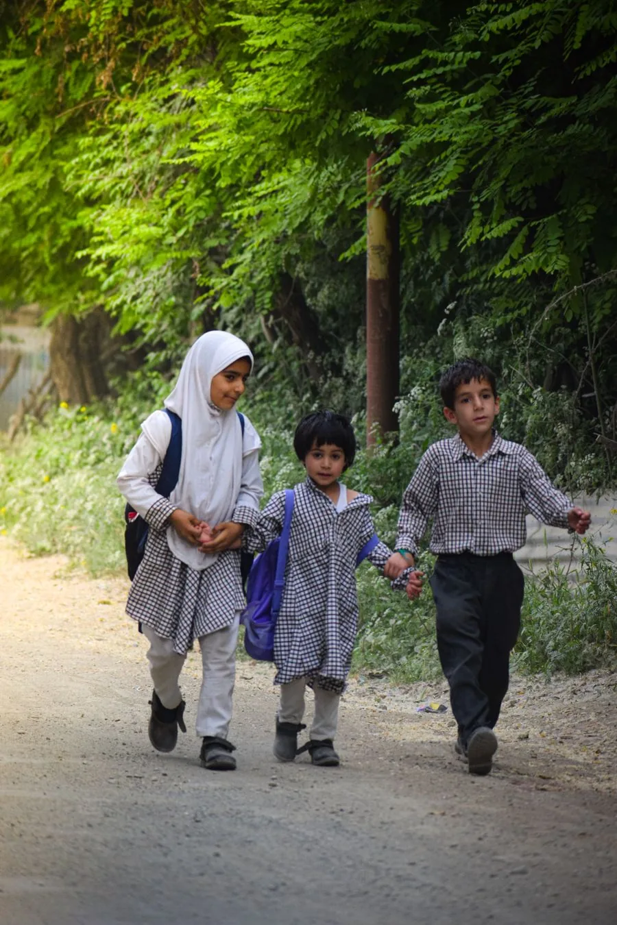 Children walking to school with their backpacks