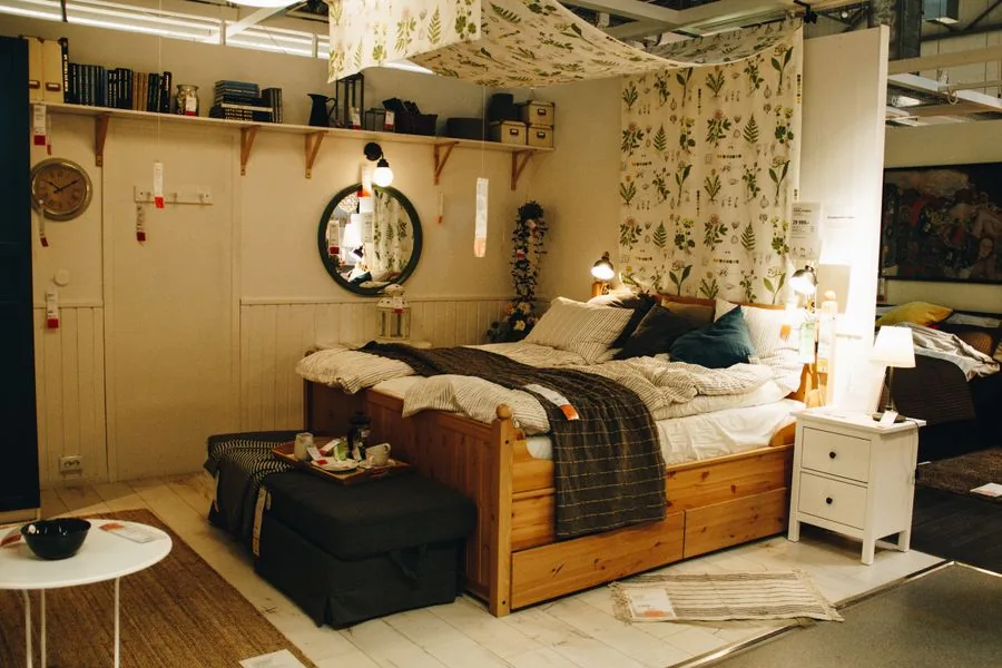 A mattress on a wooden bed frame, the kind hauled away and recycled