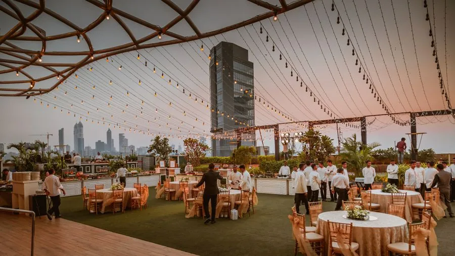 An event hall set with tables and chairs, ready for guests