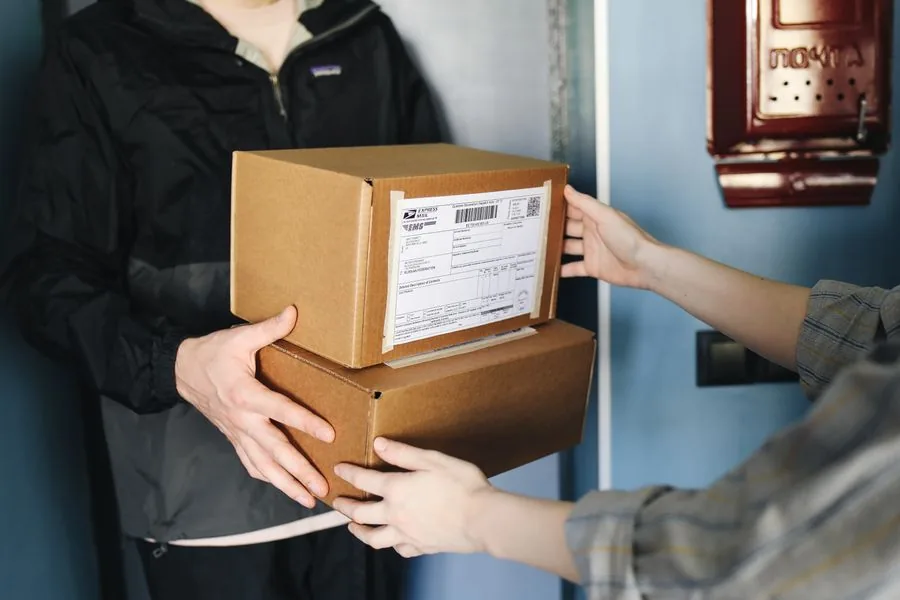 A package being handed over for pickup