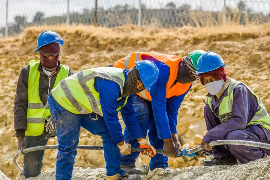 A crew of workers putting in a day's work together