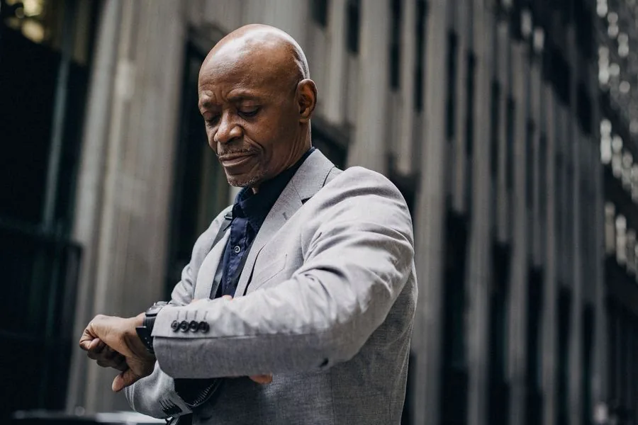 Someone checking the time, on their way to an appointment