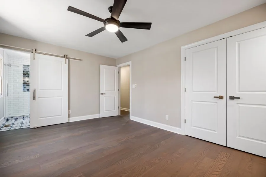 A ceiling fan mounted in a bright modern room