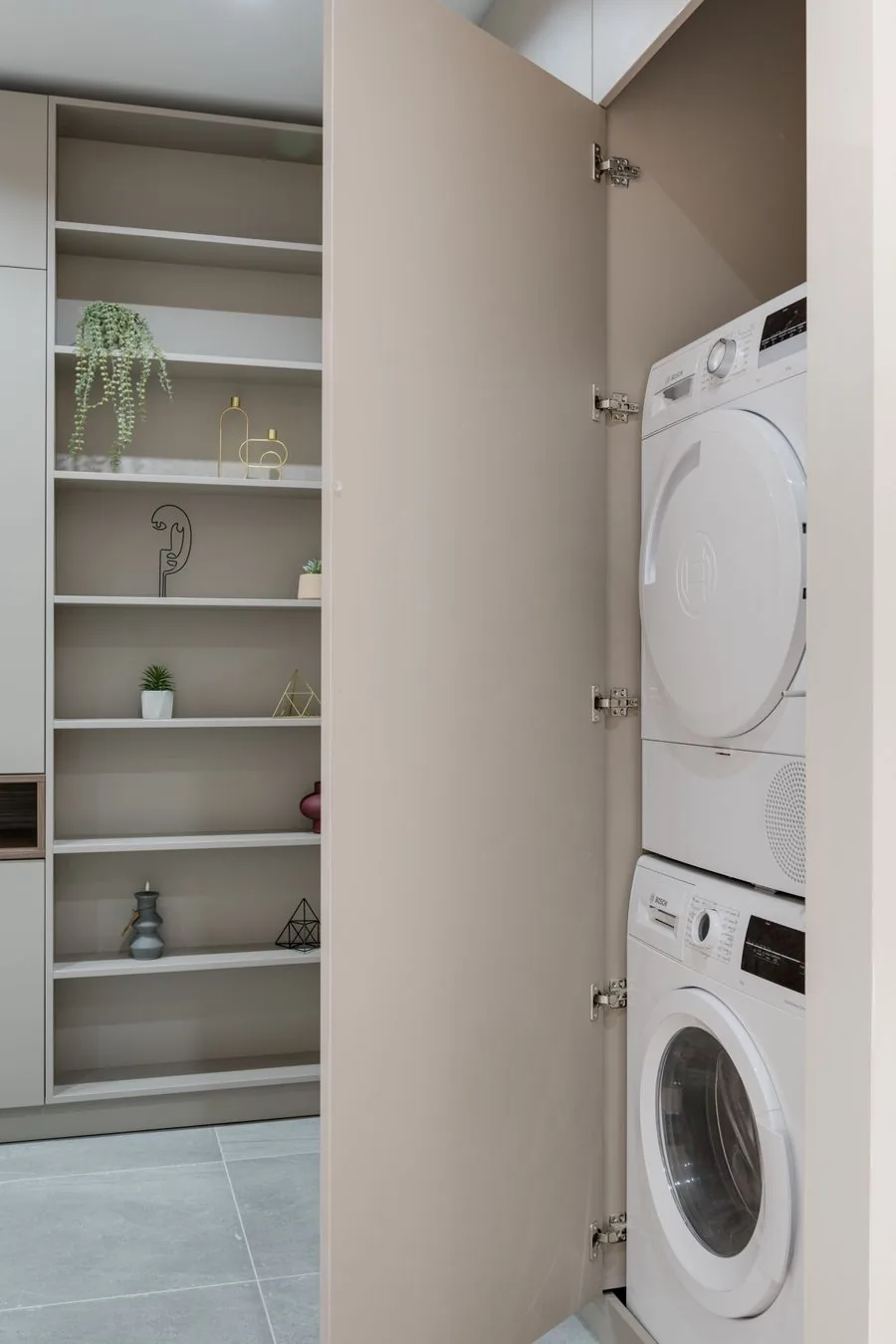 A washer and dryer in a home, ready to be moved out and into place