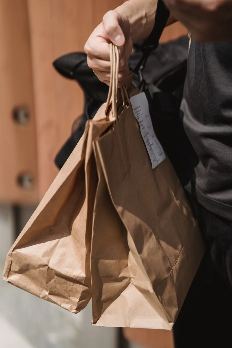 A helper running errands with shopping bags in hand
